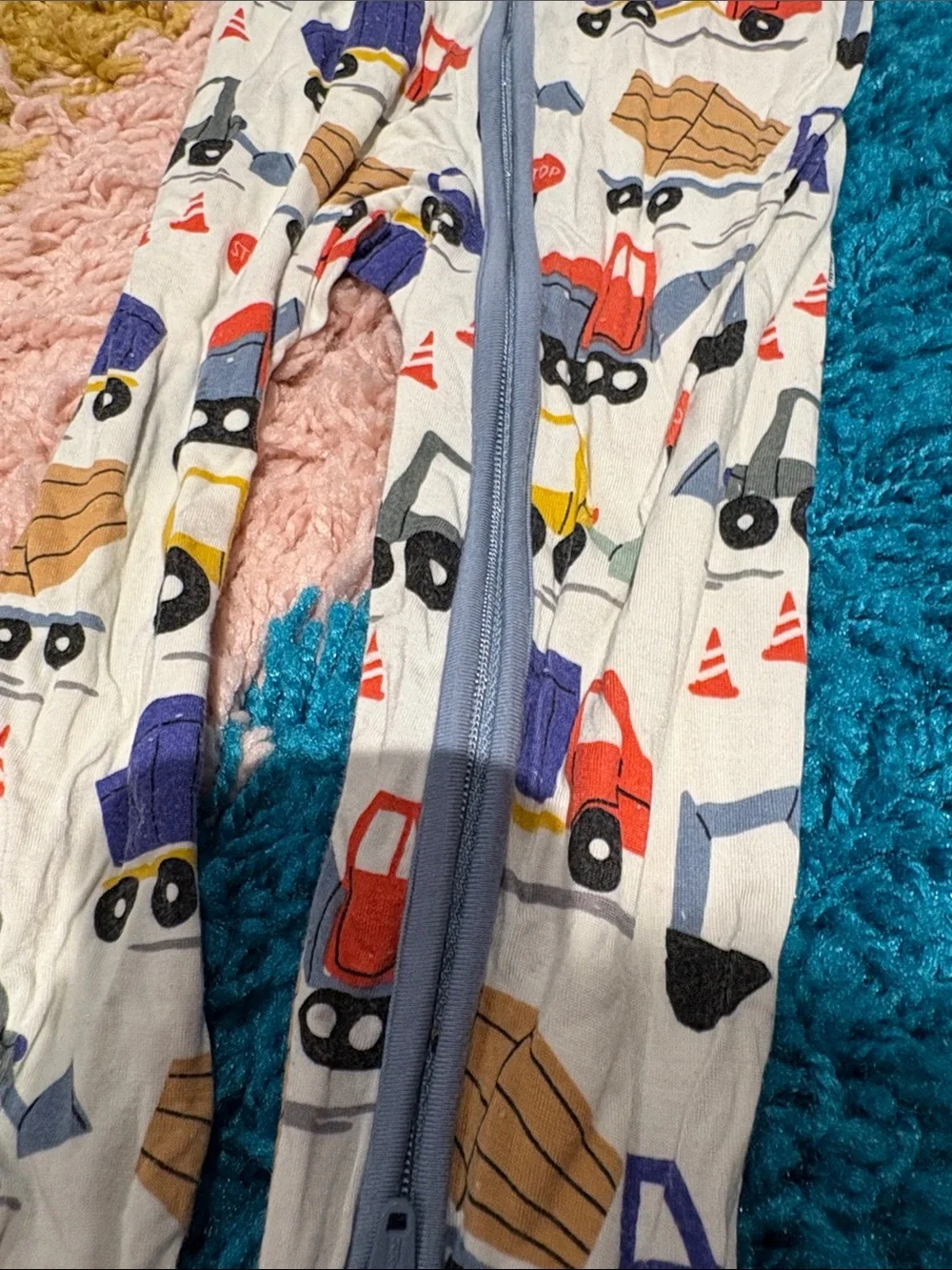 Little Sleepies White One-Piece Footie with Multicolor Truck Print and Blue Trim